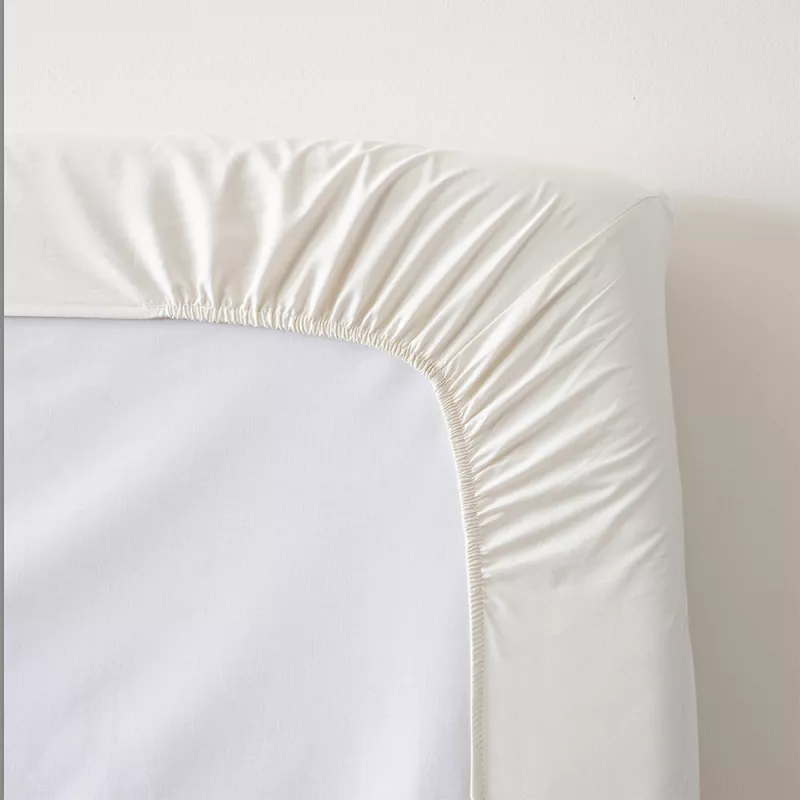 sábana bajera ajustable beige cuatro puntos de ajuste